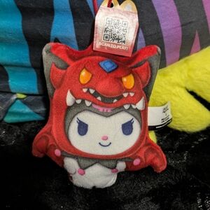 Red and Gray Plush Toy with Dragon Design